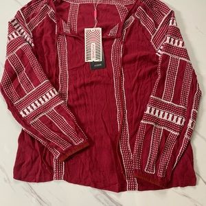 Burgundy top with silver stitching. NWT